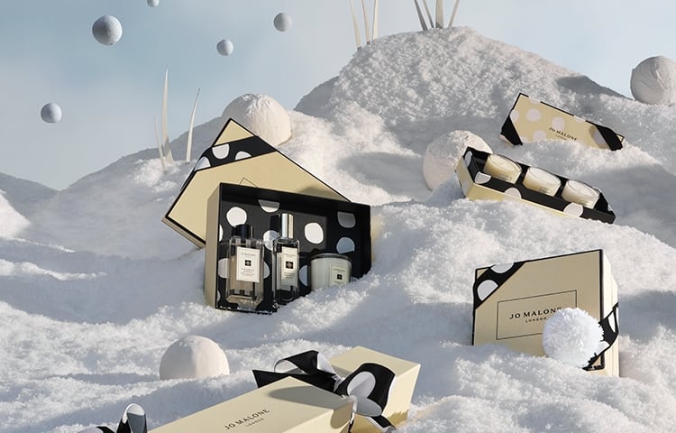 christmas limited edition products surrounded by snow and snowballs. 